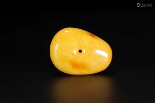 AN AMBER PENDANT