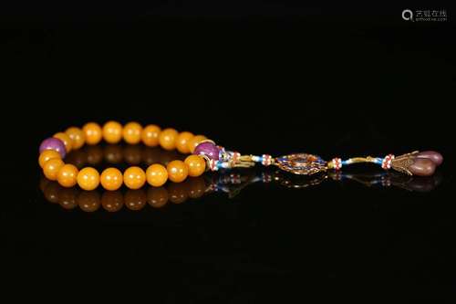 AN AMBER ROSARY