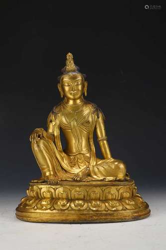 A QING DYNASTY GILT BRONZE GUANYIN ORNAMENT