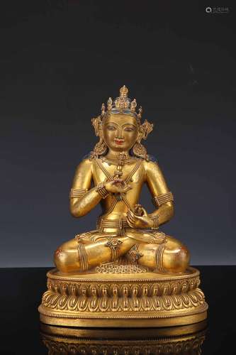 A QING DYNASTY GILT BRONZE SITTING FIGURE