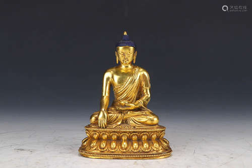 A QING DYNASTY GILT BRONZE SITTING BUDDHA