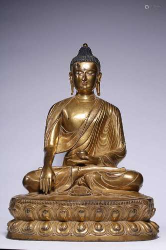 A QING DYNASTY GILT BRONZE SITTING BUDDHA