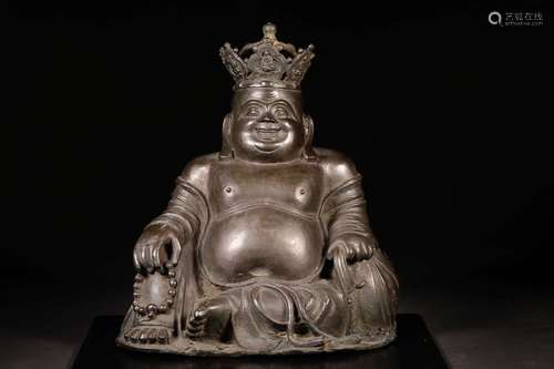 A COPPER SITTING BUDDHA