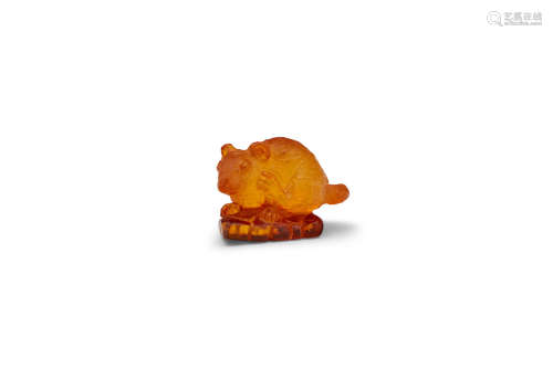 A carved amber figure of a rat  First half, 20th century