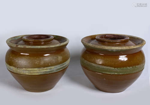 A Pair Of Amber Glazed Pottery Jars