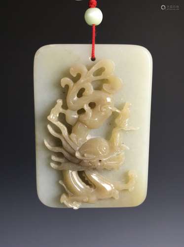 A Chinese High Relief Carved White Jade Pendant