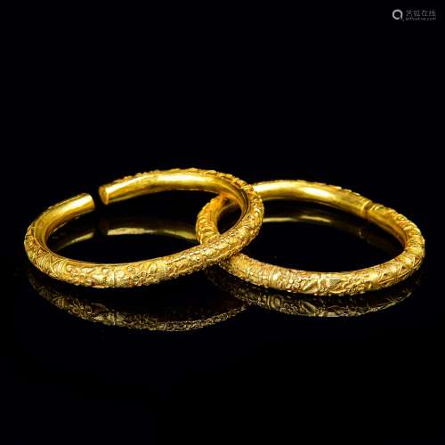 A Pair Of Ornate Chinese Gold Open End Bangles