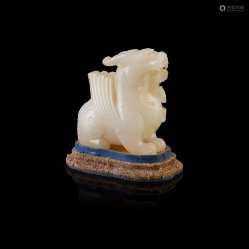 WHITE JADE CARVING OF A GRIFFIN                         QING DYNASTY, 18TH CENTURY