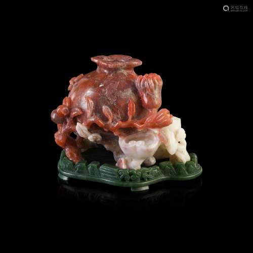 CARNELIAN CARVING OF A POMEGRANATE                         LATE QING DYNASTY-REPUBLIC PERIOD, 19TH-20TH CENTURY