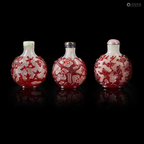 GROUP OF THREE RED OVERLAY PEKING GLASS SNUFF BOTTLES                         QING DYNASTY, 19TH CENTURY