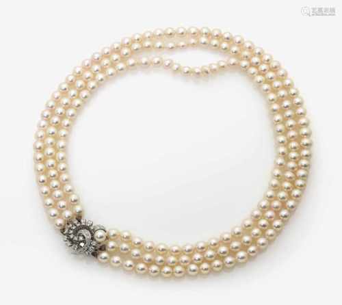 A Three-Strand Cultured Pearl Necklace with Diamond set Clasp
