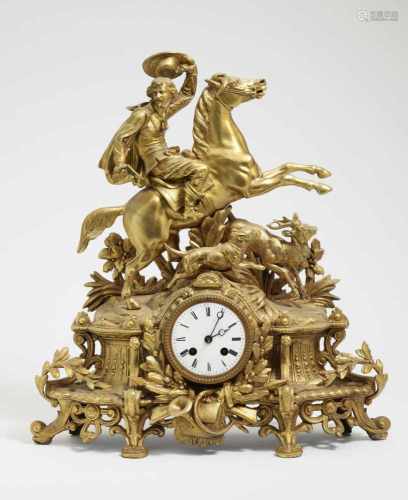 A mantle clock with deer hunt