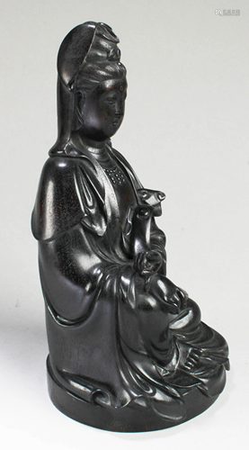 A Carved Zitan Guanyin Statue