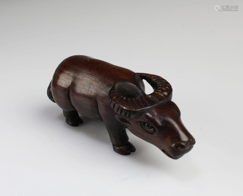 A Carved Wooden Animal Figurine