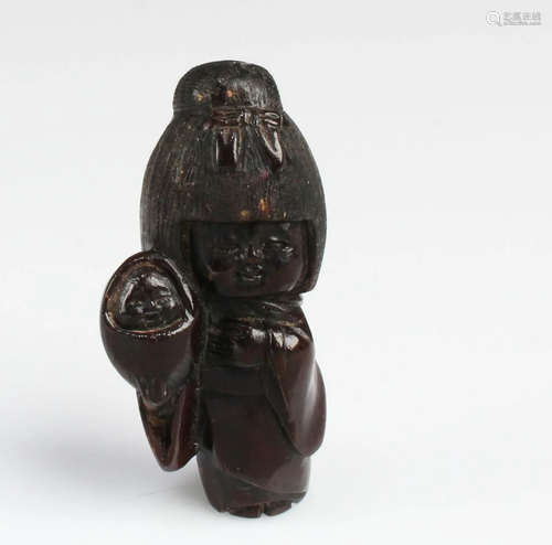 A Carved Wooden Figurine