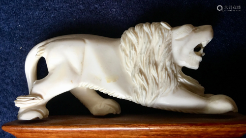 Bone carved Lion decoration, 4 x 1.75â€