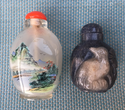 Two snuff bottles, one in blue stone, one in …