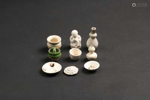 A GROUP OF POTTERY OBJECTS
