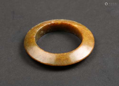 A CALCIFIED JADE RING