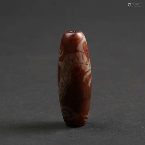 A CARVED JADE BEAD