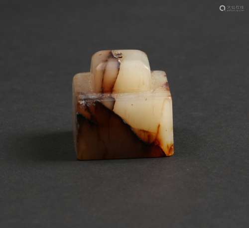 A WHITE AND RUSSET JADE SEAL STAMP