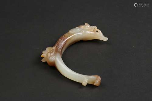 A WHITE AND RUSSET JADE ORNAMENT