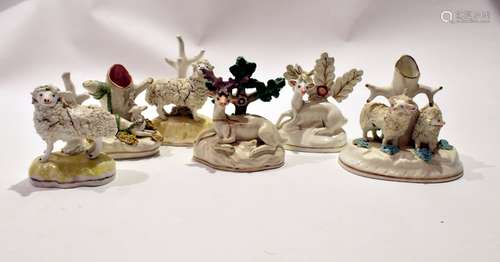 Group of Staffordshire wares including two sheep on yellow coloured bases, further group of sheep,