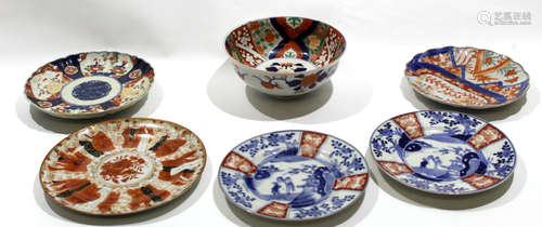 Group of Japanese porcelain wares including three Arita plates with blue and white designs and