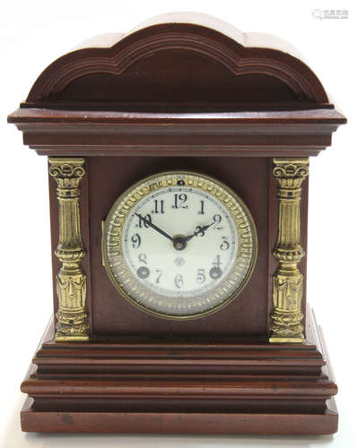 Early 20th century mantel clock with shaped brass pillars with white enamel dial white gilt