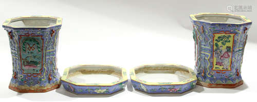 Group of two Chinese porcelain jardinieres and stands decorated in polychrome on a blue ground