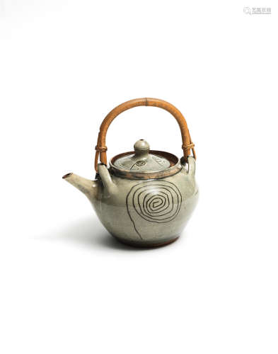 Ladi Kwali(Nigerian, circa 1925-1984) Green glazed teapot 19 x 19.5 x 15.5cm (7 1/2 x 7 11/16 x 6 1/8in) including handle..