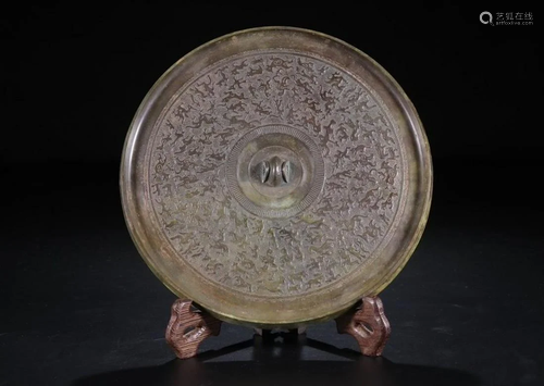 A CHINESE ARCHAIC BRONZE MIRRO…