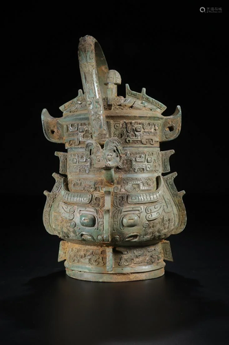 A CHINESE ARCHAIC BRONZE WINE …