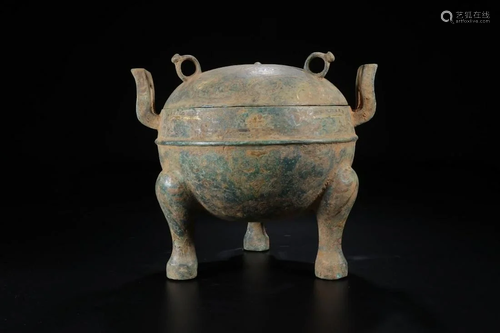 A CHINESE ARCHAIC BRONZE TRIPO…