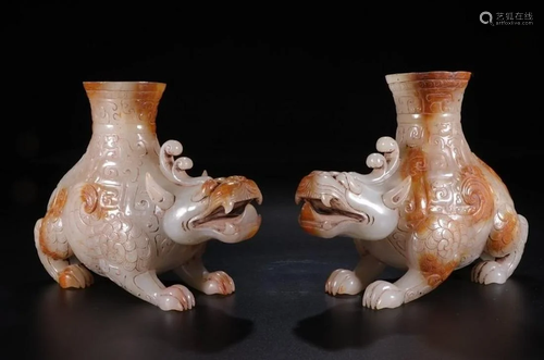 A PAIR OF CHINESE FIGURES OF MYTHICAL BE…