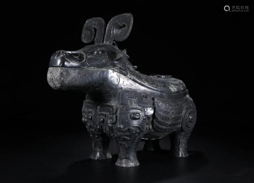 A CHINESE ARCHAICBRONZE VESSEL…