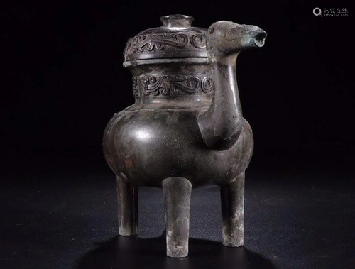 A CHINESE ARCHAIC BRONZE HE WI…