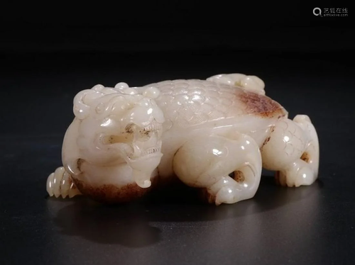 A CHINESE JADE BEAST PENDANT, HOU D…