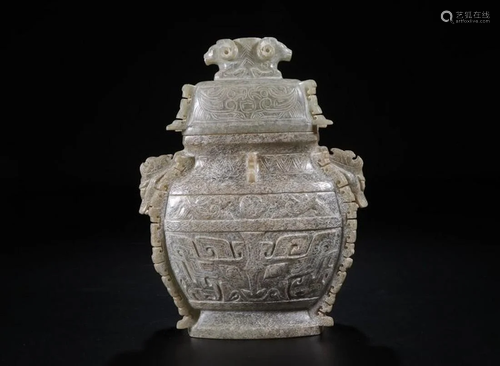 A CHINESE JADE WINE VESSEL, WARRING …