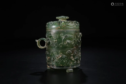 A CHINESE GREEN JADE WINE VESSEL, HE, …