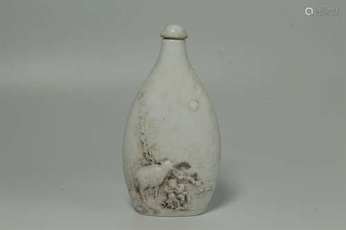 A Chinese Porcelain Carved Snuff Bottle