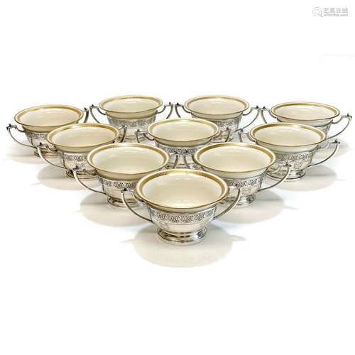 A Set of Silver Coffee Cup Saucers and Porcelain Cups