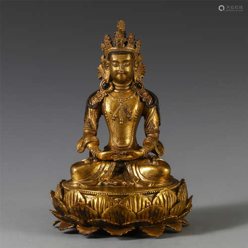 A CHINESE GILT BRONZE SEATED GUANYIN