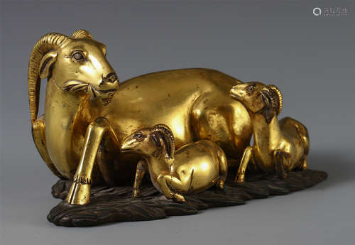 A CHINESE GILT BRONZE THREE RAMS TABLE ITEM