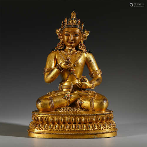 A CHINESE GILT BRONZE BUDDHIST GUARDIAN WITH ARTIFACT IN HAND