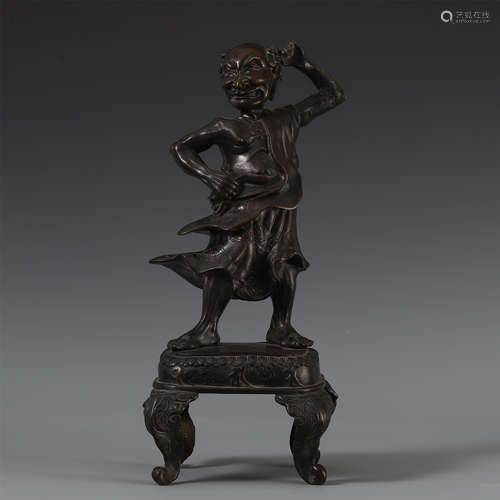 A CHINESE BRONZE CARVED SEATED ARHAT TABLE ITEM