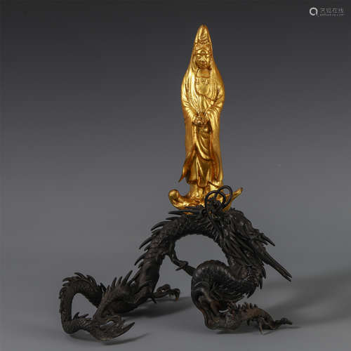 A CHINESE GILT BRONZE CARVED TABLE ITEM WITH GUANYIN ABOVE DRAGON