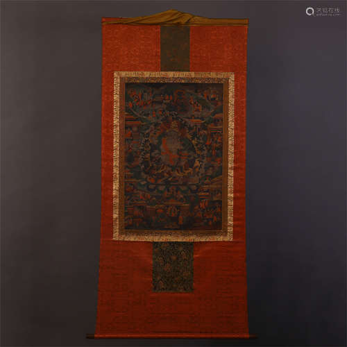 A CHINESE SILK RED GROUND SEED STITCHING THANGKA