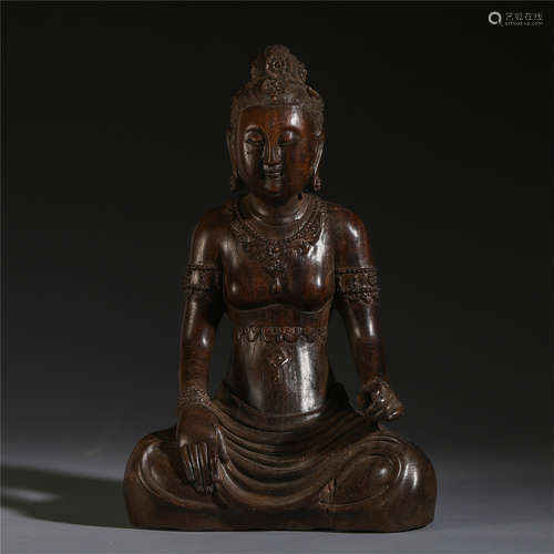 A CHINESE ROSEWOOD CARVED SEATED BUDDHIST TABLE ITEM