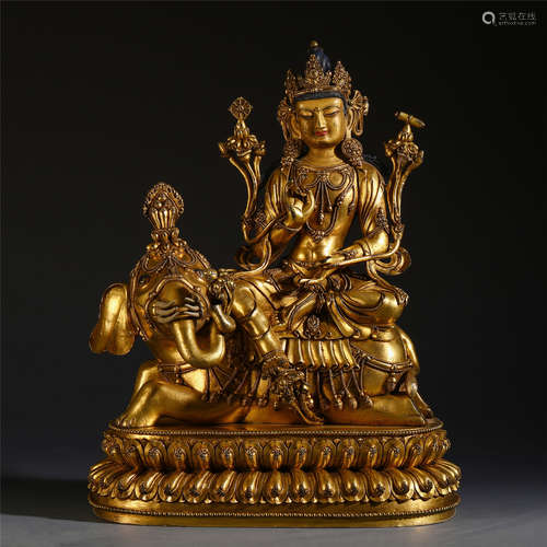 A CHINESE GILT BRONZE CARVED SEATED GUANYIN ON ELEPHANT